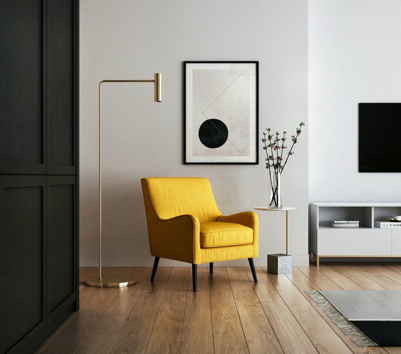 Wood floor, yellow armchair legs and the edge of a runner rug in a living room